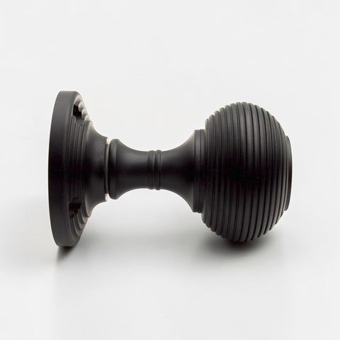 Side Profile of Black Sprung Beehive Mortice Door Knob Showing Reeded Beehive Design