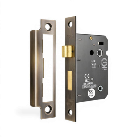 Aged brass 3 lever bathroom sash lock with strike plate and latch bolt detail
