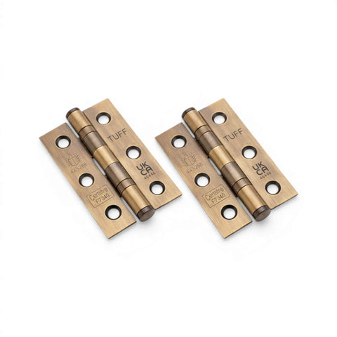Pair of aged brass ball bearing door hinges CE7 rated with TUFF branding