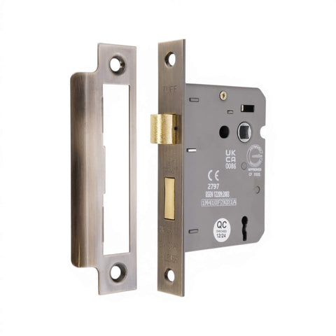 Aged brass mortice sash lock with faceplate and keep plate shown separately