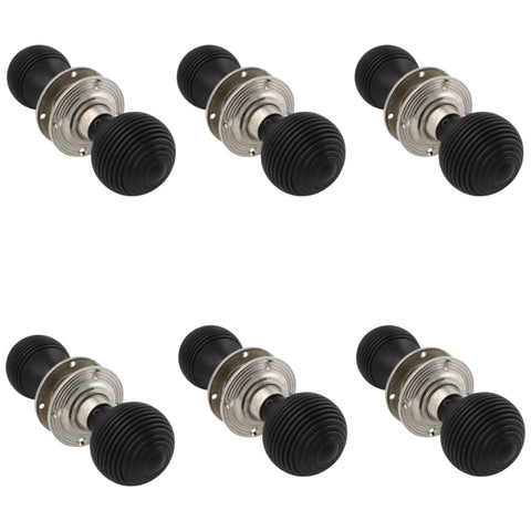 Set of six pairs of ebonised and polished nickel beehive door knobs arranged on a white background.
