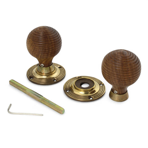 Rosewood beehive door knobs with aged brass backplates and fittings, including threaded spindle and Allen key.