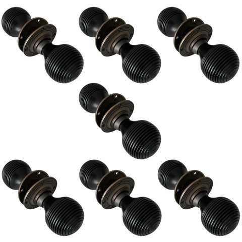 7 Pairs of Ebonised & Matt Antique Beehive Door Knobs