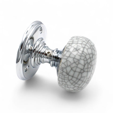 Angled view of blue crackle porcelain mortice door knob with polished chrome rose and crackle ceramic knob