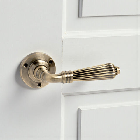 8 Pairs of Antique Brass Regency Lever Door Handles