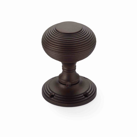 Single matt antique beehive mortice door knob with round rose backplate, crafted from solid brass for mortice door applications.