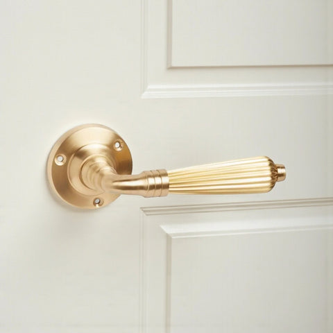8 Pairs of Satin Brass Regency Lever Door Handles