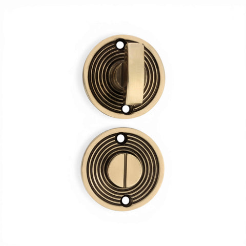 Top View of Aged Brass Beehive Thumb Turn and Emergency Release