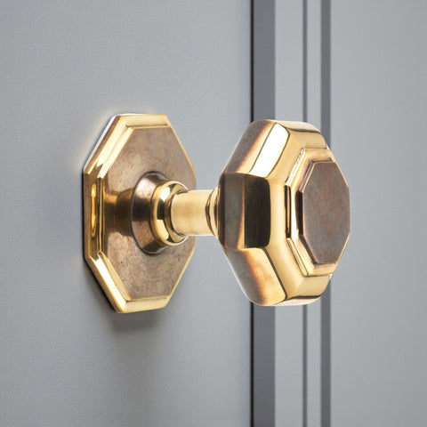 Aged Brass Octagonal Centre Door Knob On Grey Door