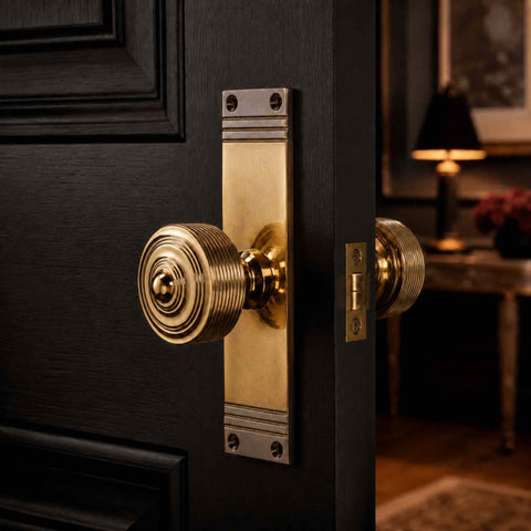Aged Brass Reeded Door Knobs On Backplate