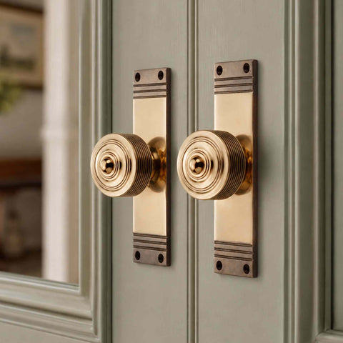 Aged Brass Reeded Door Knobs On Backplate