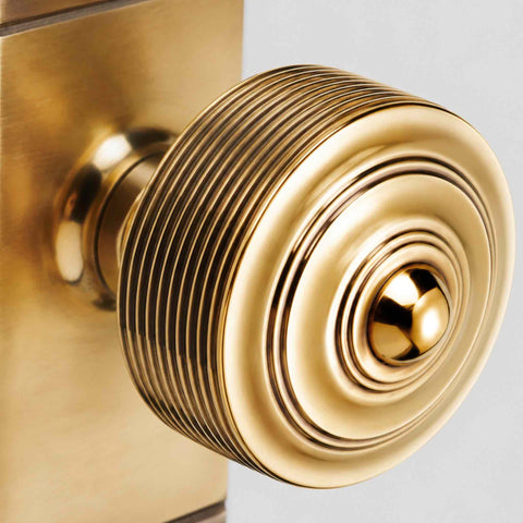 Aged Brass Reeded Door Knobs On Backplate