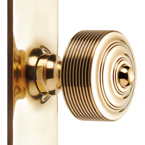aged brass reeded door knob on backplate solid brass traditional door hardware detail