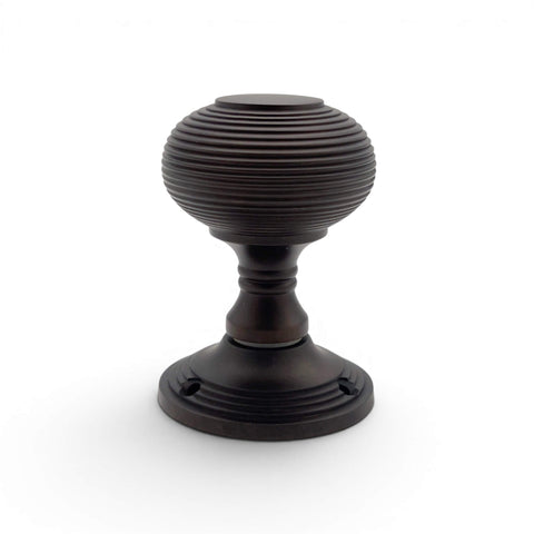 Single aged bronze beehive mortice door knob front view with stepped rose backplate