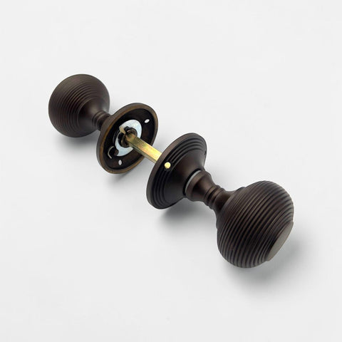 Internal view of aged bronze beehive mortice door knobs with spindle connection