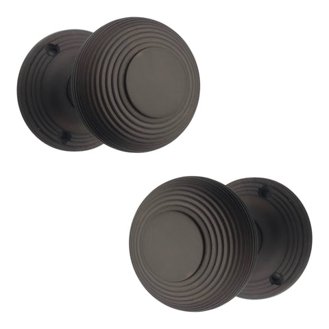 Top view of aged bronze beehive mortice door knobs with concentric ring design
