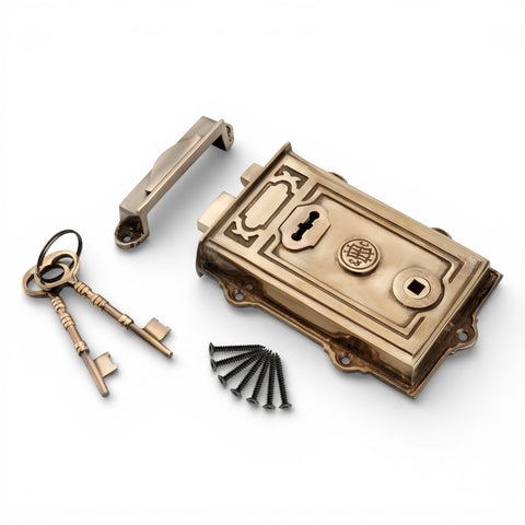 Alternative angled view of aged solid brass Davenport Victorian rim lock with keys, keep, and fixing screws.