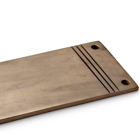 Close-up of reeded detailing on solid brass push plate with unlacquered antique finish and countersunk fixing holes