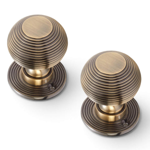 Pair of Reeded Antique Brass Beehive Mortice Door Knobs