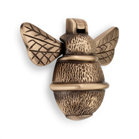 Antique brass bumble bee door knocker, front view showing detailed wings and textured body.