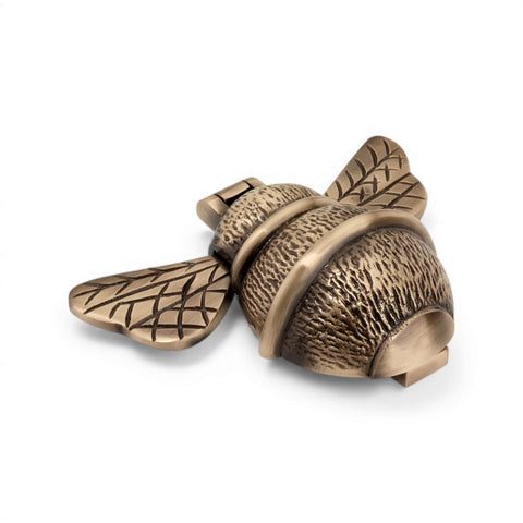 Antique brass bumble bee door knocker, full front view with engraved wing pattern and striking body design.