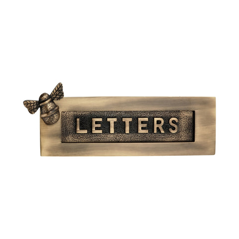 Antique brass bumble bee "LETTERS" letter plate with raised lettering and decorative bee motif on a white background.