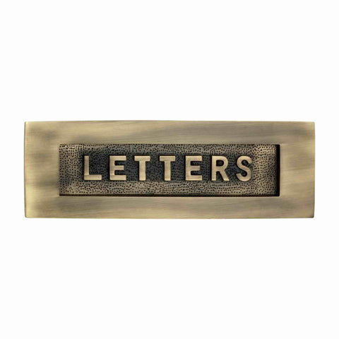 Front view of antique brass LETTERS letter plate showing raised lettering and textured detailing