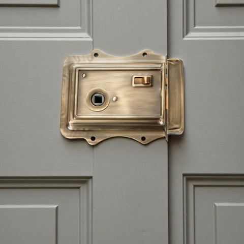 Olde Victorian rim lock in antique brass finish installed on panelled interior door