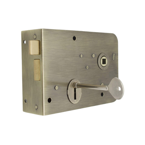 Traditional antique brass scotch rim lock with key inserted