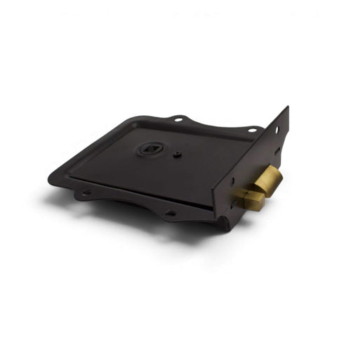 Low side profile view of black rim lock with antique brass latch bolt and decorative edge detail.