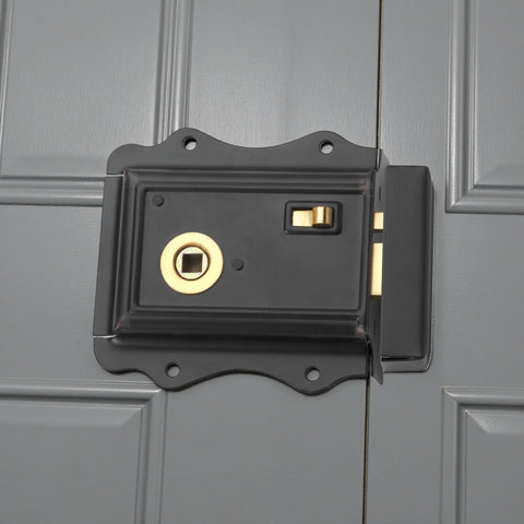 Black Olde Victorian rim lock with polished brass latch fitted to painted timber door