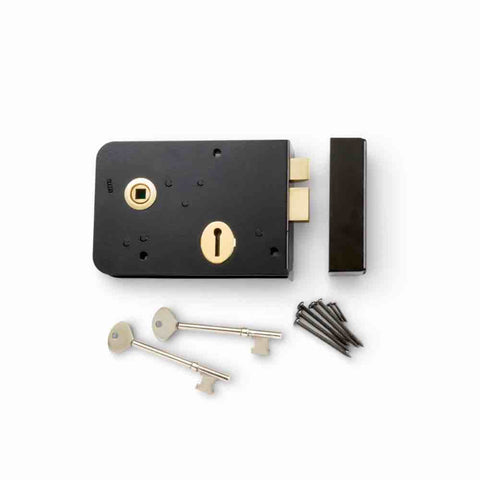 Front view of black and polished brass left hand Scotch rim lock with keys, keep and fixing screws