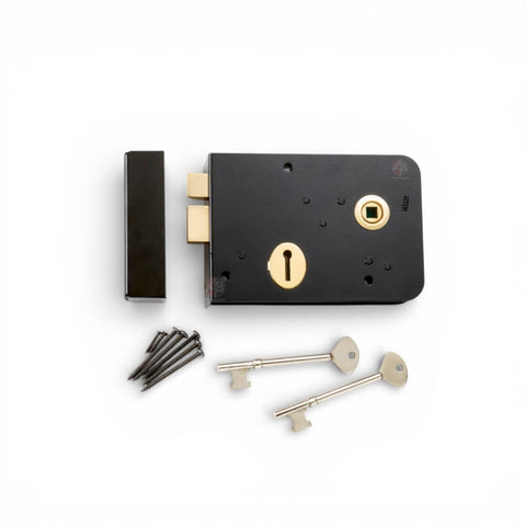 Front view of black Scotch rim lock with polished brass keyhole and follower