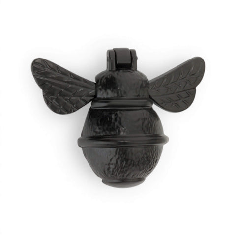 Black cast iron bumble bee door knocker straight on view showing textured body and matt powder coated surface