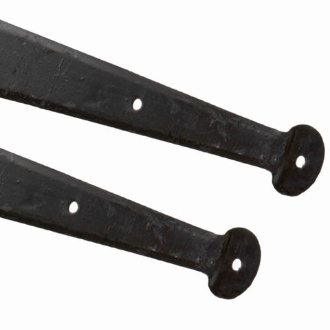 Close-up of traditional penny end detail on black wrought iron T hinges