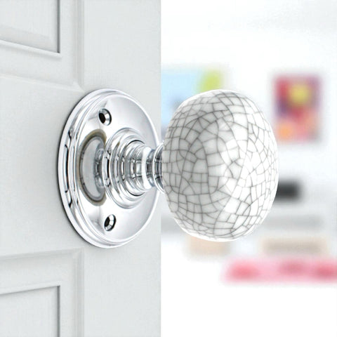 Side view of blue crackle porcelain polished chrome mortice door knob on interior door