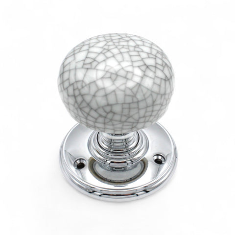 Blue crackle porcelain door knob close up with polished chrome rose