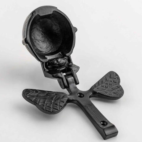 Black cast iron bumble bee door knocker shown open with rear fixing plate and mounting holes visible