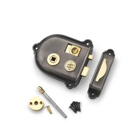 Cromwell cast iron rim lock with brass spindle, brass latch, and matching keep on a white background.