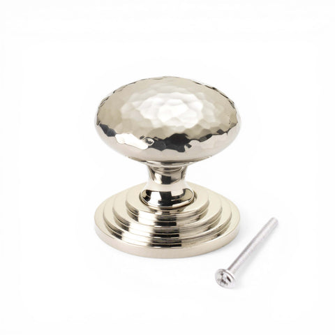 38mm solid polished nickel hammered cupboard knob with stepped backplate and fixing screw on white background