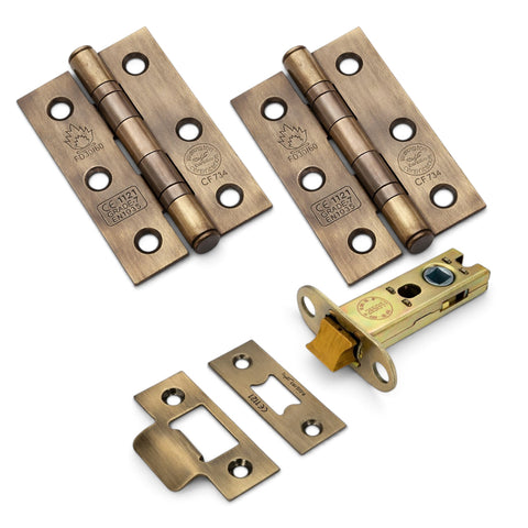 Antique brass complete door fitting kit with pair of CE7 ball bearing hinges, heavy-duty tubular latch and matching strike plates.