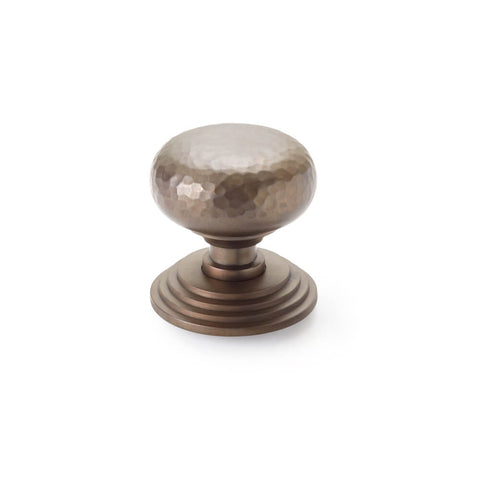 Hammered matt antique cottage centre door knob with stepped circular backplate, front view on white background