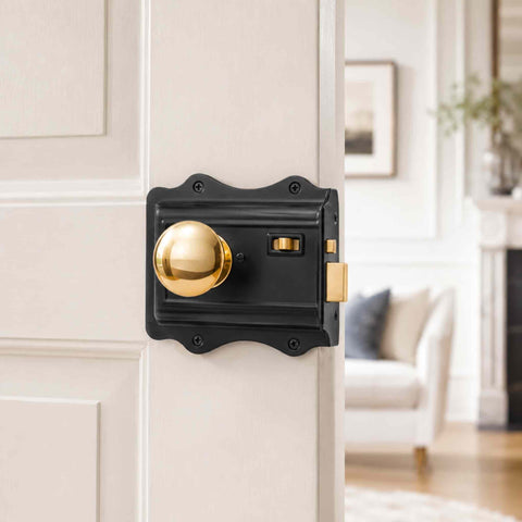 Old Victorian Style Solid Brass Mushroom Door Knob on Black Rim Lock Fitted to Black Door