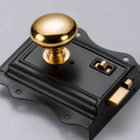 Macro Close-Up of Polished Solid Brass Mushroom Door Knob Showing Reflective Finish