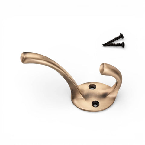 Single antique brass Victorian coat hook with fixing screws, dual hook design and circular backplate