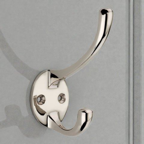 Polished nickel Victorian coat hook fitted to door with dual hook design and round backplate