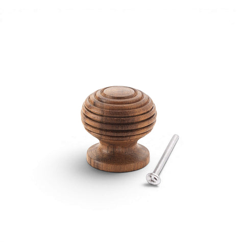 Small rosewood beehive cupboard knob with fixing screw on light grey background