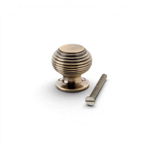 Small antique brass beehive cupboard knob with threaded fixing bolt