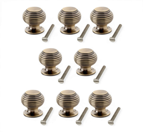 Pack of 8 small antique brass beehive cupboard knobs with fixing screws