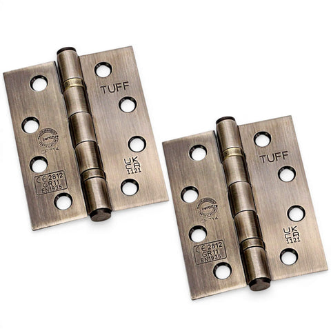 Antique brass CE11 ball bearing butt hinges pair, 100mm steel fire rated door hinges on white background.